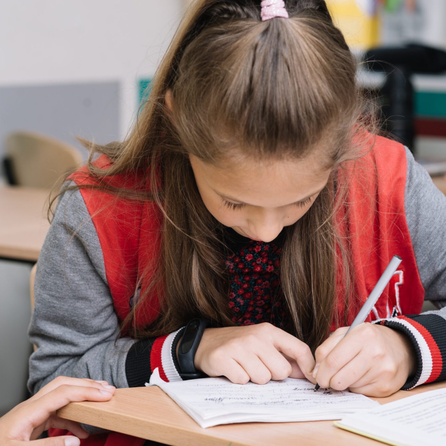 schoolgirl-writing-class